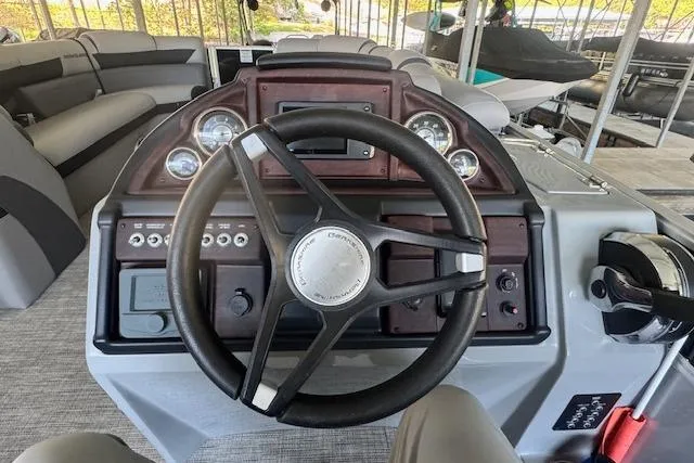 Slide: The Image of Steering console of 2022 Berkshire 250CL STS pontoon boat with gauges and controls. - 11