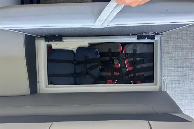 Slide: The Image of 2022 Berkshire 250CL STS boat storage compartment with life jackets inside. - 30