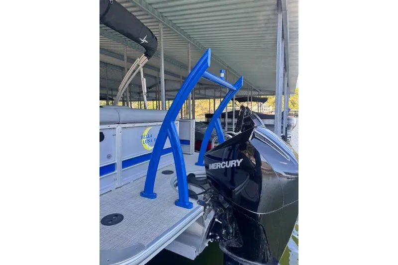 Slide: The Image of 2022 Berkshire 250CL STS pontoon boat with Mercury engine at dock. - 33