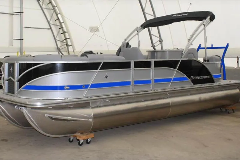 Slide: The Image of 2022 Berkshire 250CL STS pontoon boat in a showroom setting. - 9