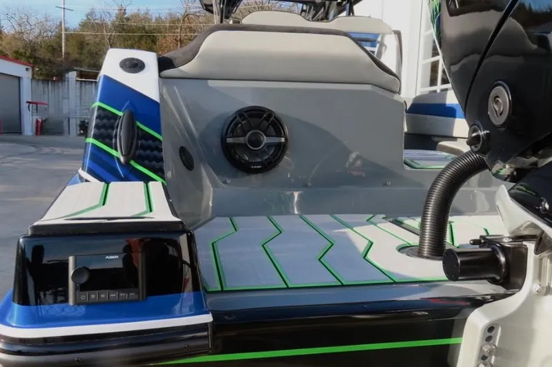 Slide: The Image of 2025 Sunsation 32 CCX boat with sleek design, vibrant accents, and modern audio system. - 7