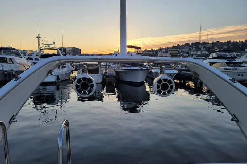 Slide: The Image of 1998 Bayliner 2858 Ciera Command Bridge at sunset in marina, with cityscape background. - 15