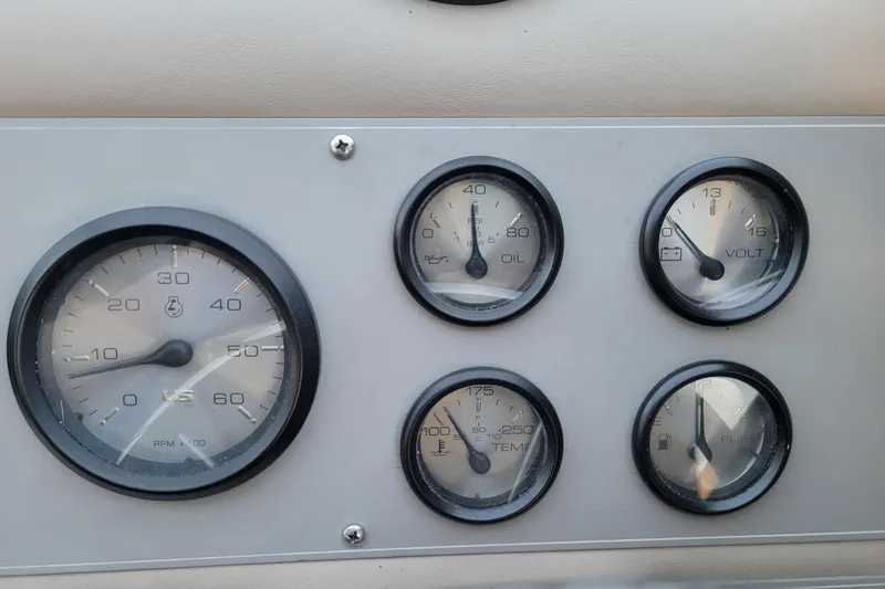Slide: The Image of Dashboard gauges of a 1998 Bayliner 2858 Ciera Command Bridge boat. - 21