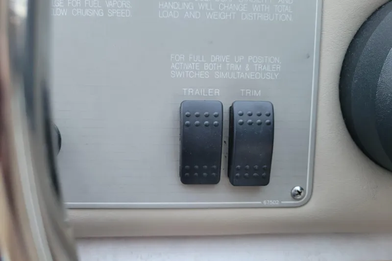 Slide: The Image of Control panel of 1998 Bayliner 2858 Ciera Command Bridge with trailer and trim switches. - 22