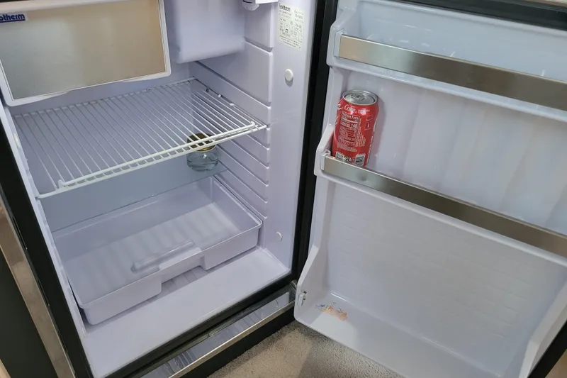 Slide: The Image of Open fridge in 1998 Bayliner 2858 Ciera Command Bridge with a soda can inside. - 36