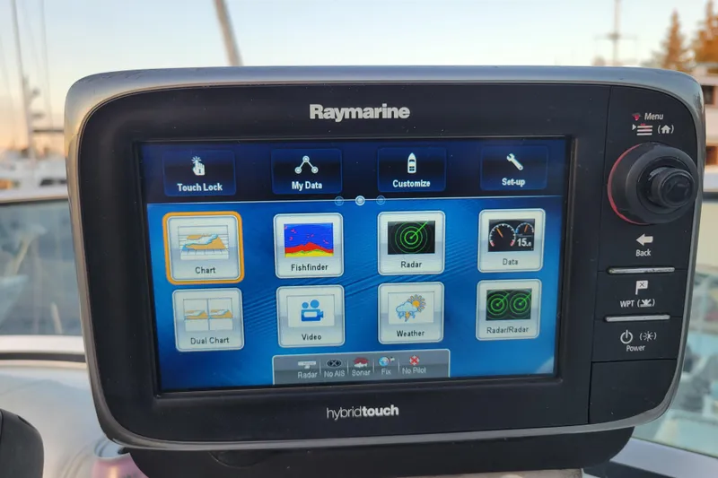 Slide: The Image of Raymarine hybridtouch display on 1998 Bayliner 2858 Ciera Command Bridge, showing navigation and data options. - 38