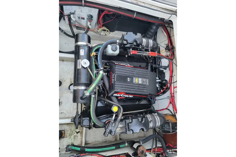 Slide: The Image of Engine compartment of 1998 Bayliner 2858 Ciera Command Bridge with MerCruiser engine. - 42