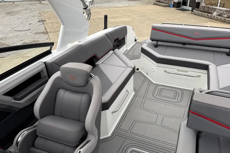 Slide: The Image of 2021 Cobalt R8 Surf boat interior with gray seating and modern design. - 12