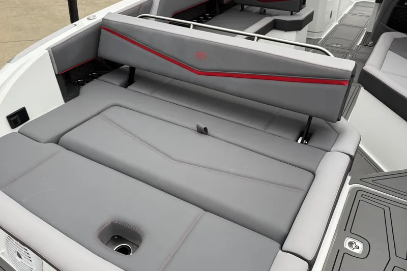Slide: The Image of 2021 Cobalt R8 Surf boat interior with gray seating and red accents. - 17