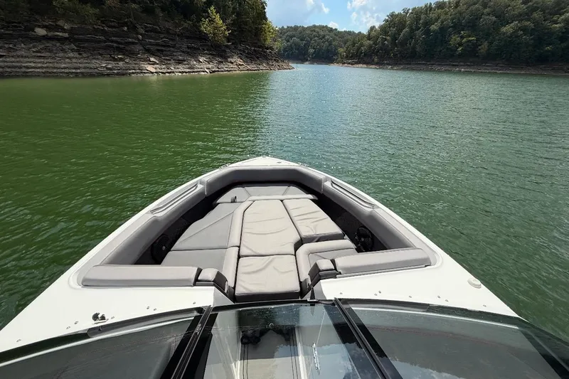 Slide: The Image of 2021 Cobalt R8 Surf boat dashboard with steering wheel and control panel. - 8