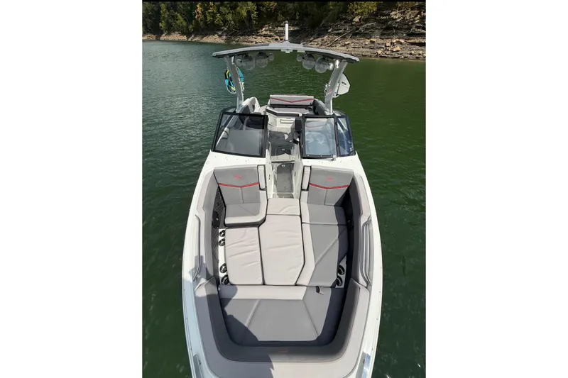 Slide: The Image of Dashboard of 2021 Cobalt R8 Surf boat with navigation screens and steering wheel. - 9