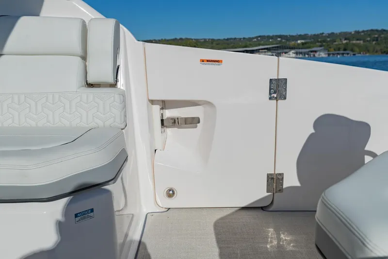 Slide: The Image of 2023 Regal LS36 boat interior with white seating and sleek design. - 13