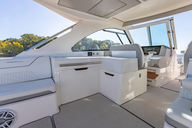 Slide: The Image of 2023 Regal LS36 boat interior with modern seating and sleek design. - 17