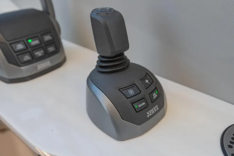 Slide: The Image of Joystick control system on 2023 Regal LS36 boat, featuring Volvo Penta technology. - 33
