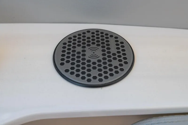 Slide: The Image of 2023 Regal LS36 wireless charging pad with hexagonal design on a white surface. - 34