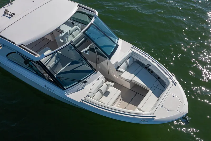 Slide: The Image of 2023 Regal LS36 boat on water, featuring sleek design and spacious seating. - 4