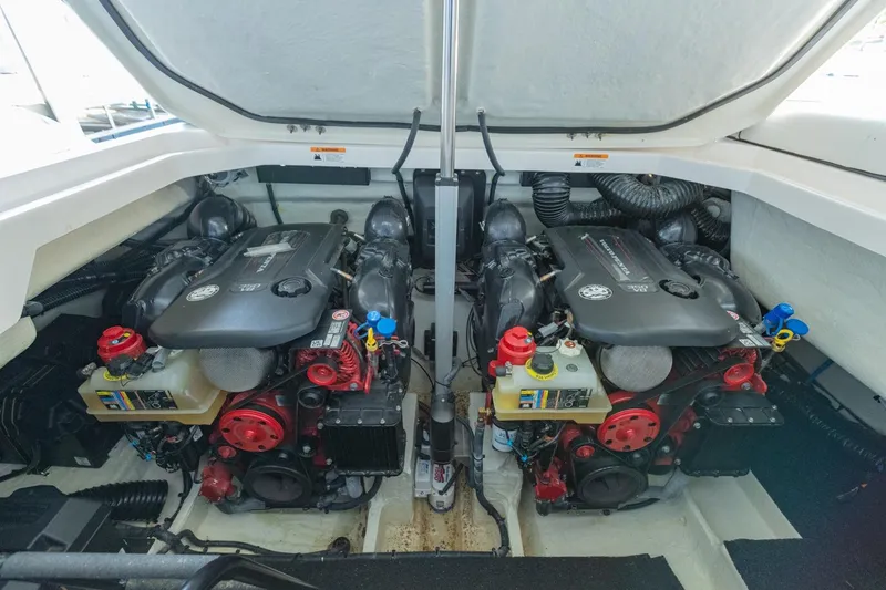 Slide: The Image of Engine compartment of 2023 Regal LS36 boat, featuring dual powerful engines. - 45