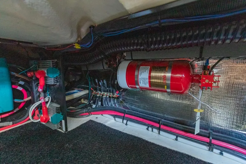 Slide: The Image of 2023 Regal LS36 engine compartment with fire extinguisher and wiring system. - 46