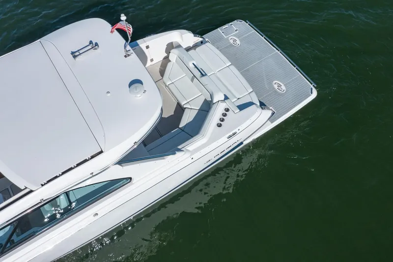 Slide: The Image of 2023 Regal LS36 luxury boat on water, aerial view, sleek design, spacious deck. - 5