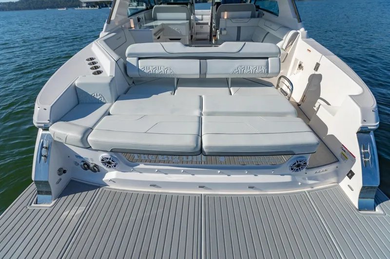 Slide: The Image of 2023 Regal LS36 boat with spacious rear seating and luxurious design on water. - 7