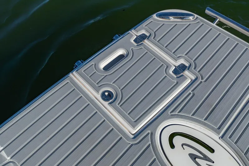 Slide: The Image of 2023 Regal LS36 boat deck with sleek design and water backdrop. - 8