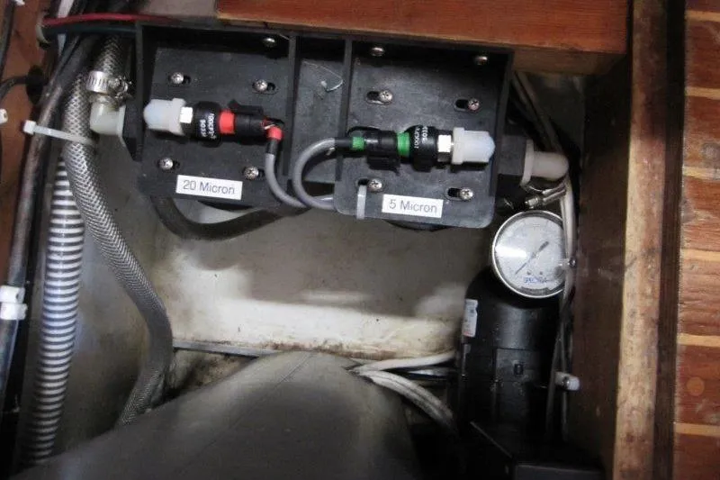 Slide: The Image of 1983 Nauticat 43 yacht interior with wooden cabinets and sink. - 10