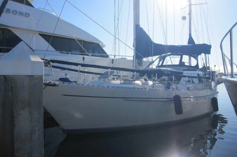 Slide: The Image of Electrical components inside a 1983 Nauticat 43 sailboat, showcasing wiring and connections. - 18