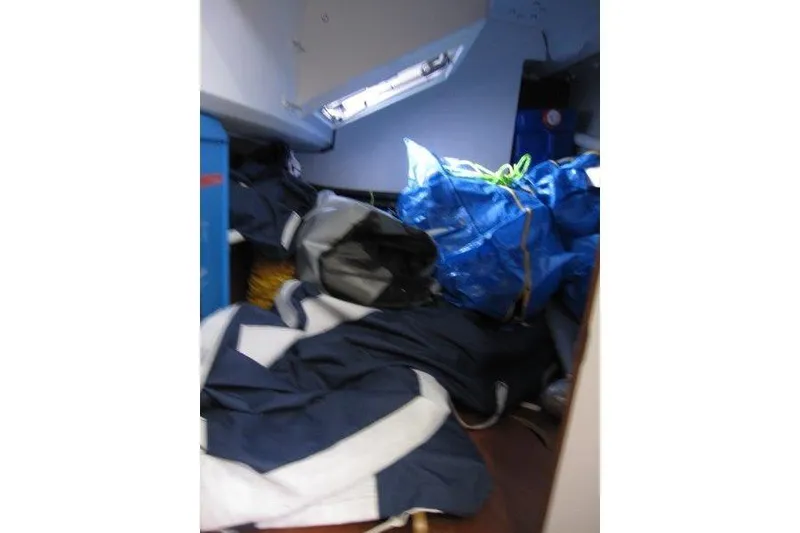 Slide: The Image of Interior of 2022 Jeanneau Sun Odyssey 349 with stored sailing gear and equipment. - 19