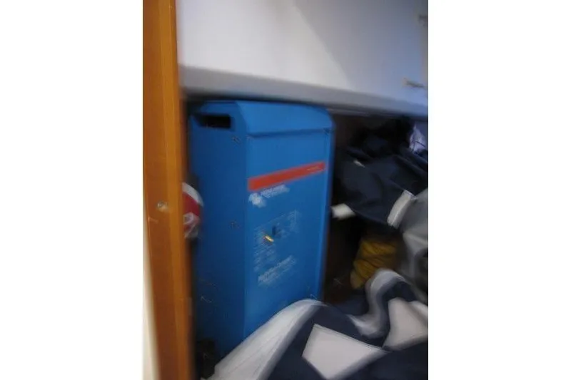 Slide: The Image of Blue equipment inside Jeanneau Sun Odyssey 349 yacht, 2022 model, partially obscured by fabric. - 20
