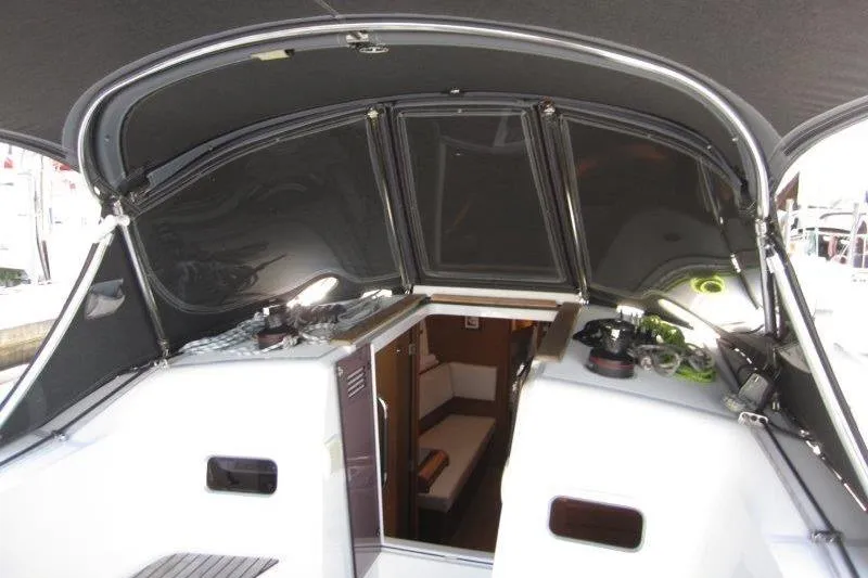Slide: The Image of Interior view of 2022 Jeanneau Sun Odyssey 349 sailboat cockpit and cabin entrance. - 30