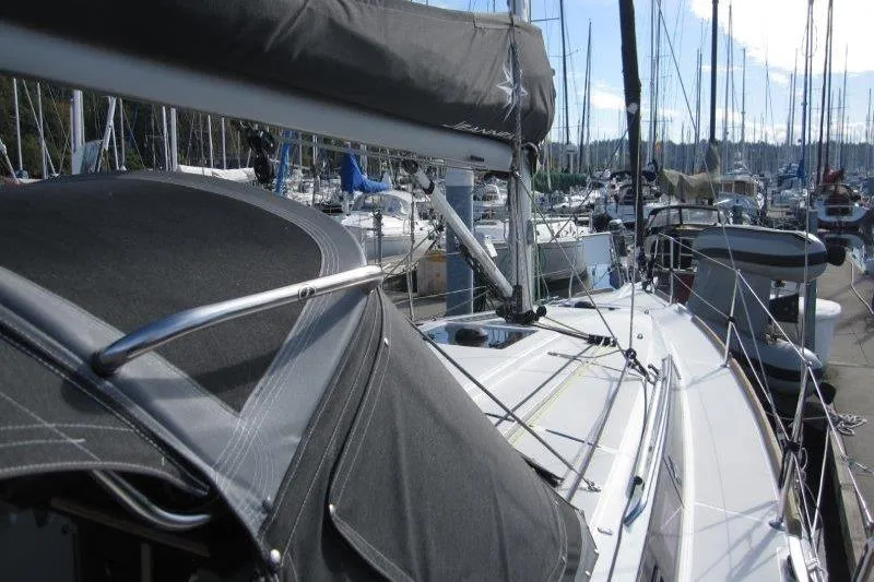 Slide: The Image of Jeanneau Sun Odyssey 349 sailboat, 2022 model, docked in a marina with other boats. - 36
