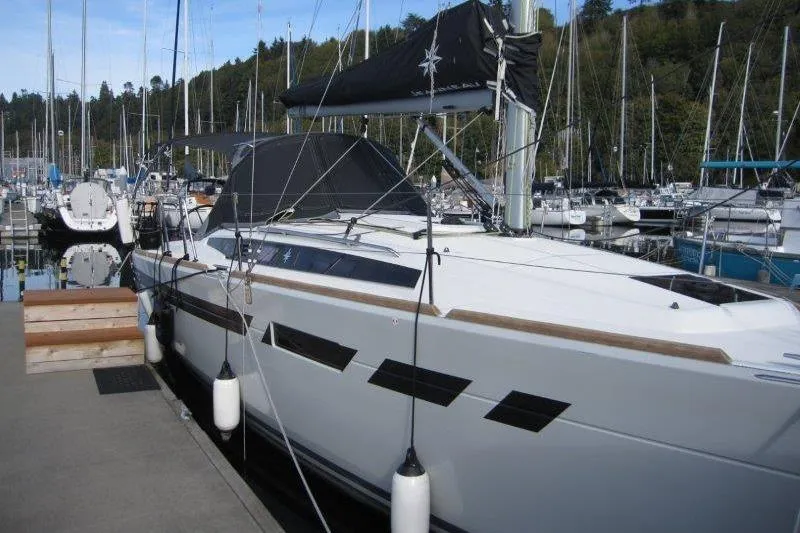 Slide: The Image of 2022 Jeanneau Sun Odyssey 349 yacht docked at marina, surrounded by other boats. - 46