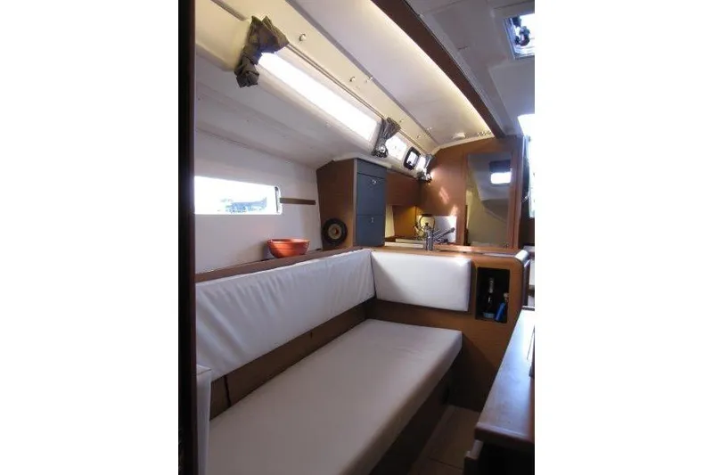 Slide: The Image of Interior of 2022 Jeanneau Sun Odyssey 349 sailboat, featuring cozy seating and modern design. - 9