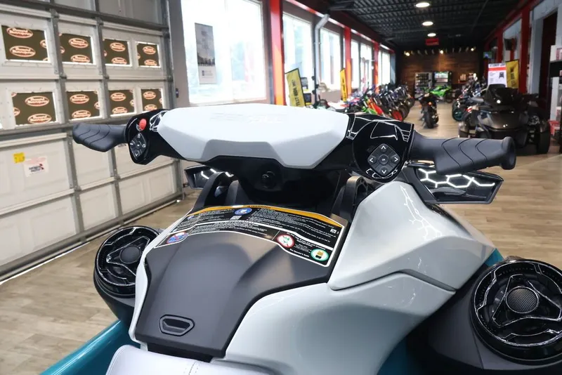 Slide: The Image of 2026 Sea-Doo GTI SE 170 in showroom, close-up of handlebars. - 9