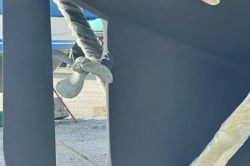 Slide: The Image of Propeller of 2000 Island Packet 380 sailboat in dry dock, wrapped for protection. - 5