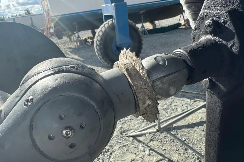 Slide: The Image of Close-up of Island Packet 380 propeller shaft with marine growth, 2000 model. - 7