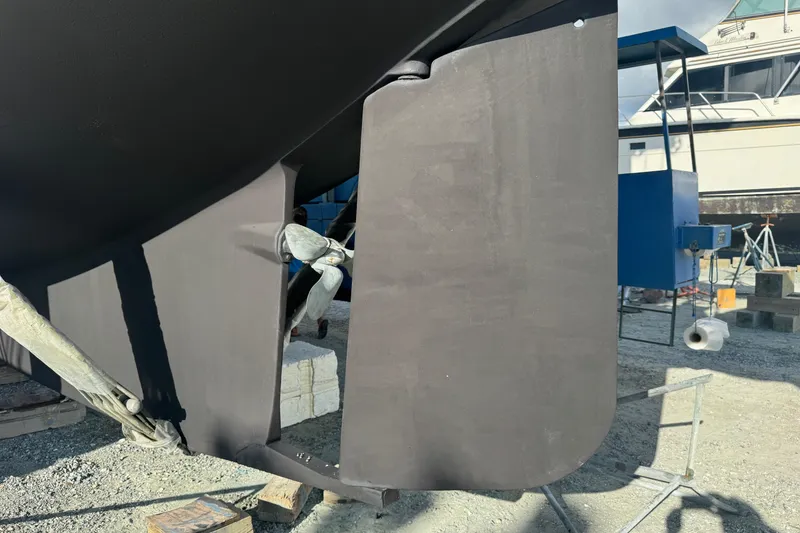 Slide: The Image of Island Packet 380 sailboat rudder and propeller, 2000 model, on dry dock. - 8
