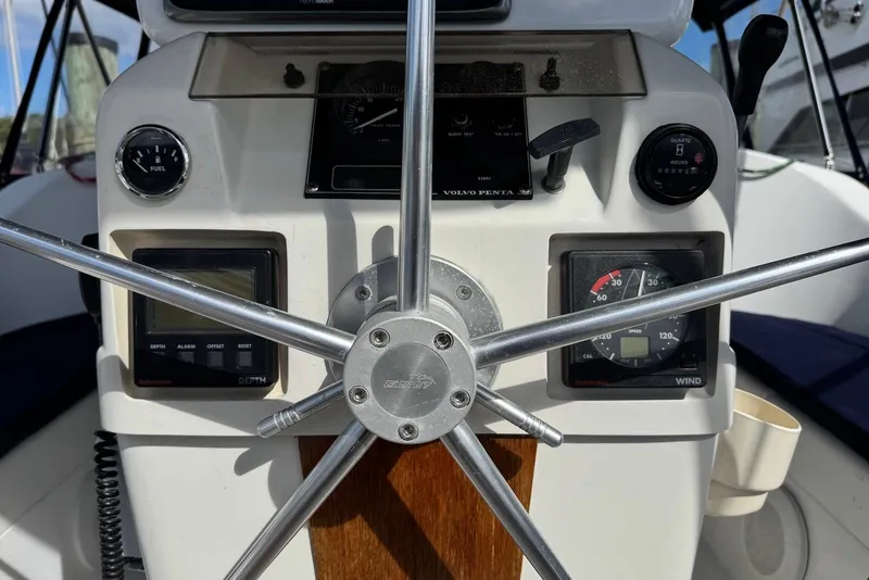 Slide: The Image of Steering wheel and instrument panel of 1992 Beneteau Oceanis 370 sailboat. - 11