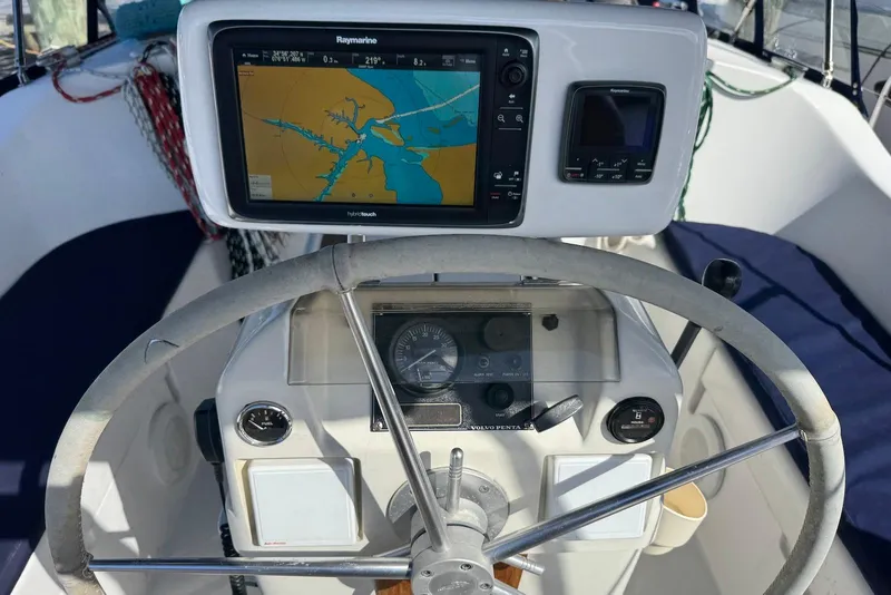Slide: The Image of Steering wheel and navigation system on 1992 Beneteau Oceanis 370 sailboat. - 13