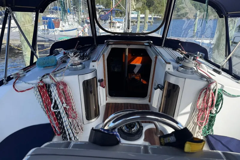 Slide: The Image of Cockpit view of a 1992 Beneteau Oceanis 370 sailboat with ropes and winches. - 16