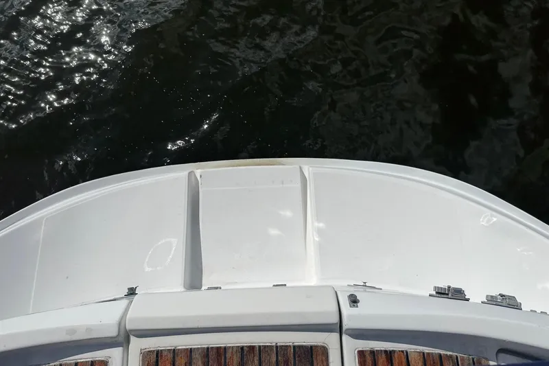 Slide: The Image of Bow of a 1992 Beneteau Oceanis 370 sailboat on water. - 17