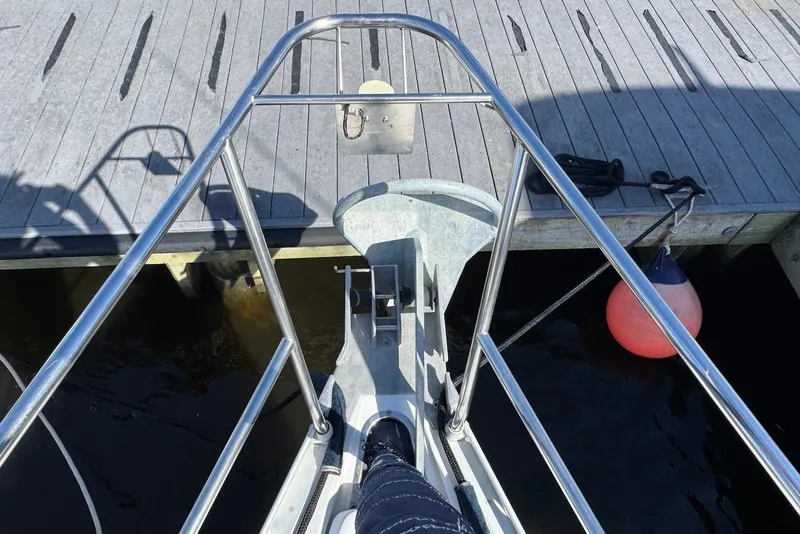 Slide: The Image of Bow view of 1992 Beneteau Oceanis 370 sailboat docked with anchor and buoy. - 19