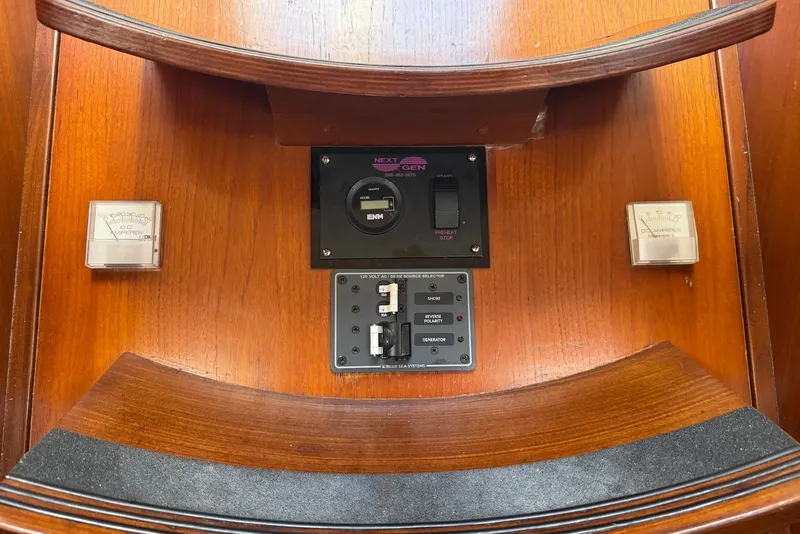 Slide: The Image of Control panel of a 1992 Beneteau Oceanis 370 sailboat with gauges and switches. - 33