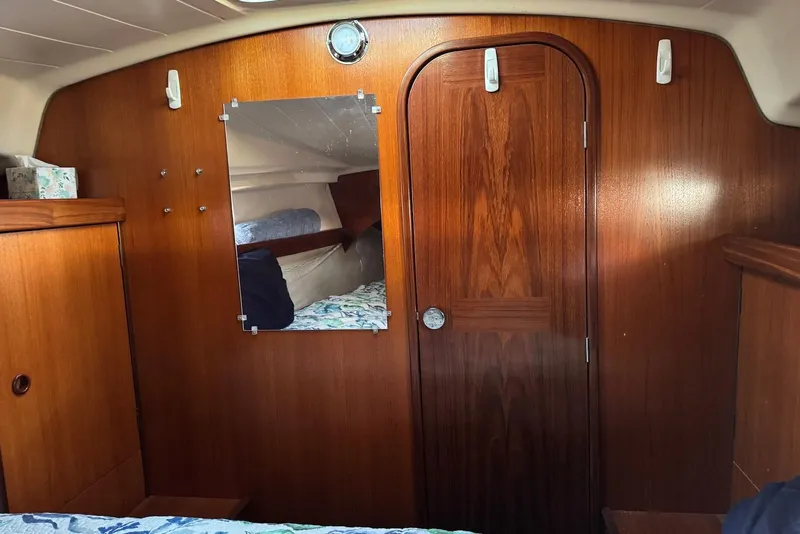 Slide: The Image of Interior of 1992 Beneteau Oceanis 370 sailboat with wooden paneling and mirror. - 40