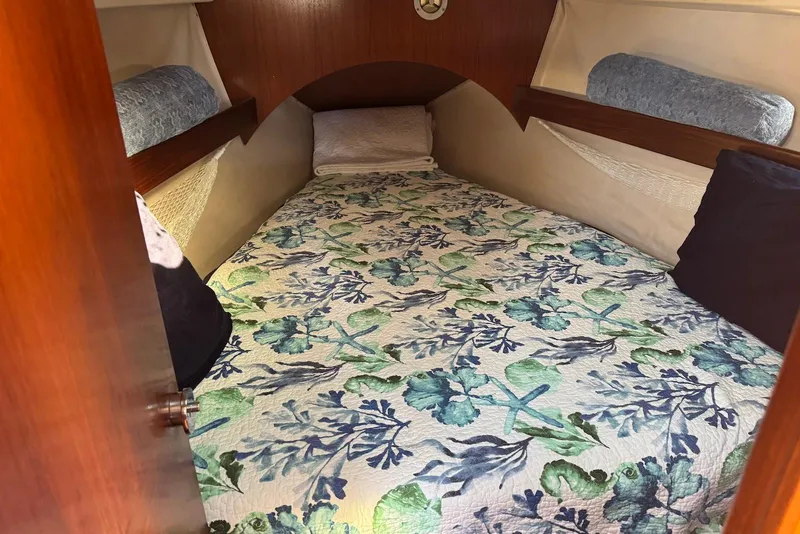 Slide: The Image of Cozy cabin interior of 1992 Beneteau Oceanis 370 with floral bedding. - 45