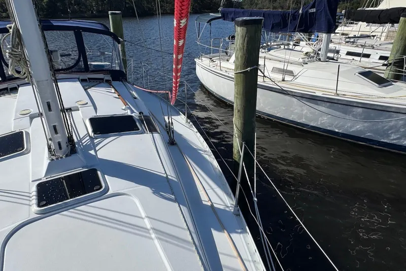Slide: The Image of Beneteau Oceanis 370 sailboat docked, 1992 model, with visible deck and rigging. - 5