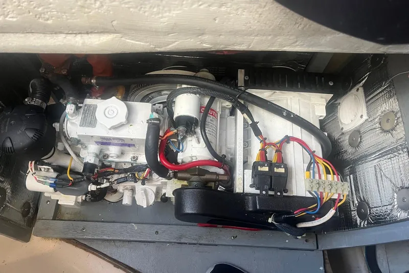 Slide: The Image of Engine compartment of a 1992 Beneteau Oceanis 370 sailboat, showcasing wiring and components. - 50