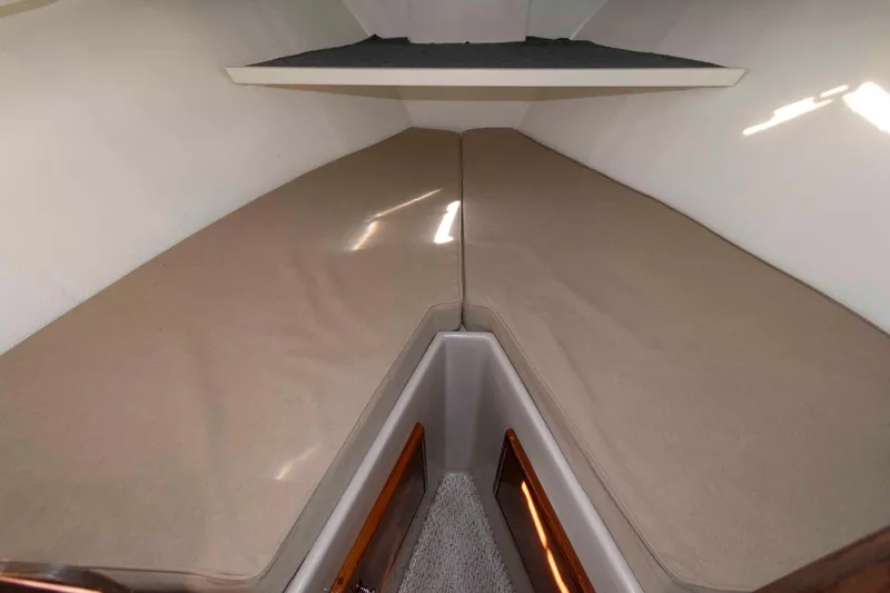 Slide: The Image of Interior cabin of 1982 Nauset 27 Downeast Cruiser with beige cushions. - 18