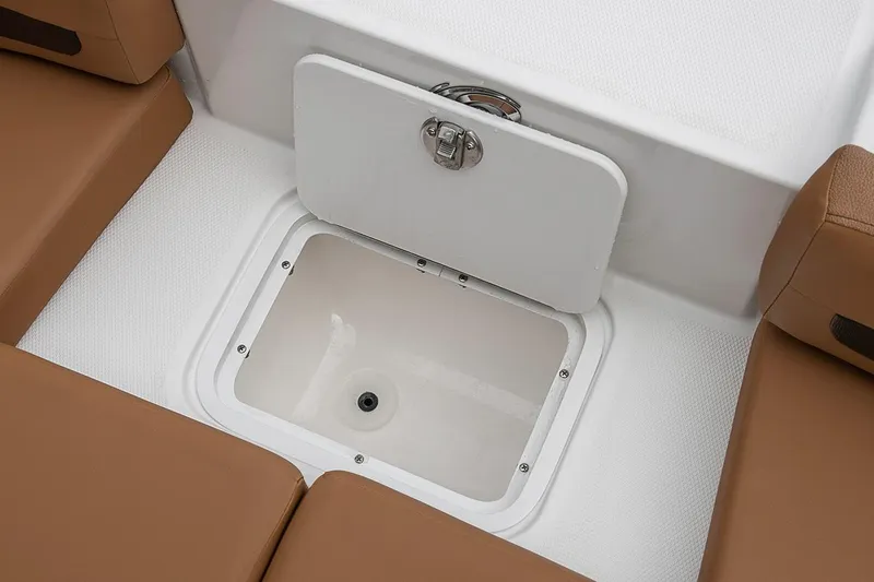 Slide: The Image of Manufacturer Provided Image: 2022 Hurricane SunDeck 235 OB storage compartment with brown seating. - 9