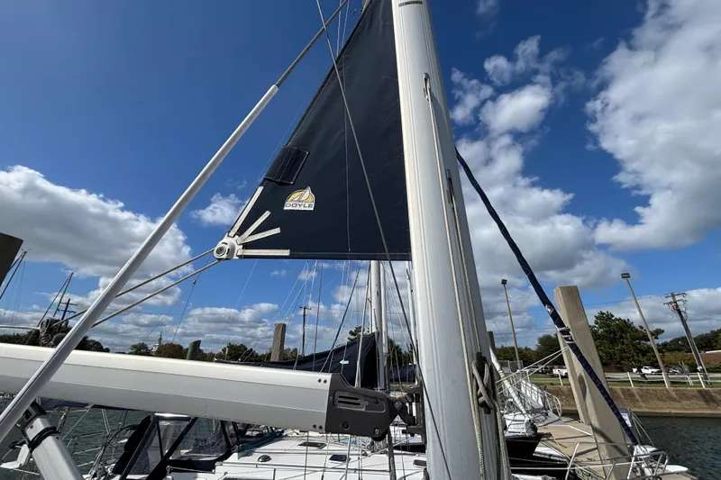 Slide: The Image of Sailboat mast and sail of 2006 Hunter 38 under a clear blue sky. - 12